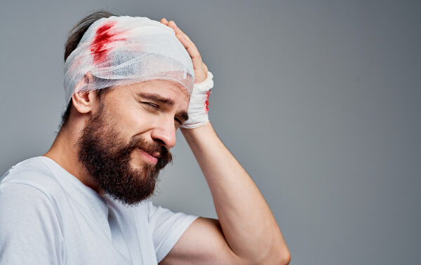 bigstock-Man-With-Bandaged-Head-And-Blo-399658502-600x379